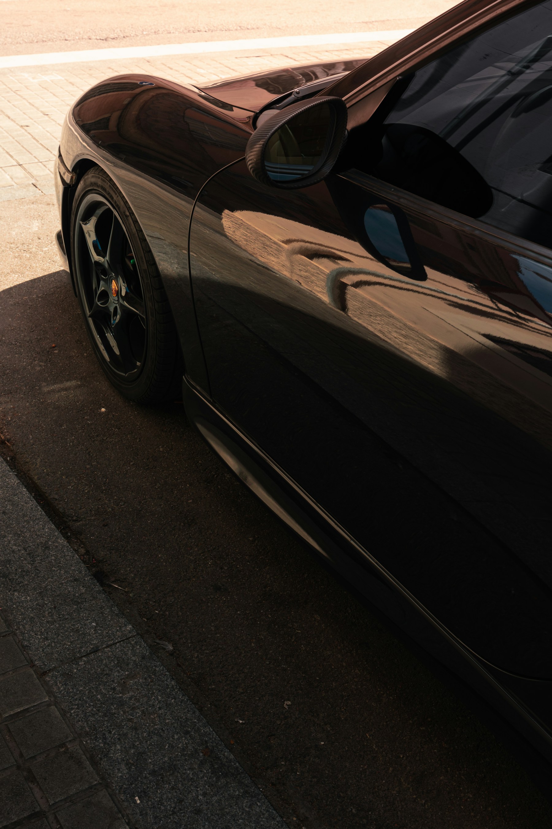 Polished black car bodywork
